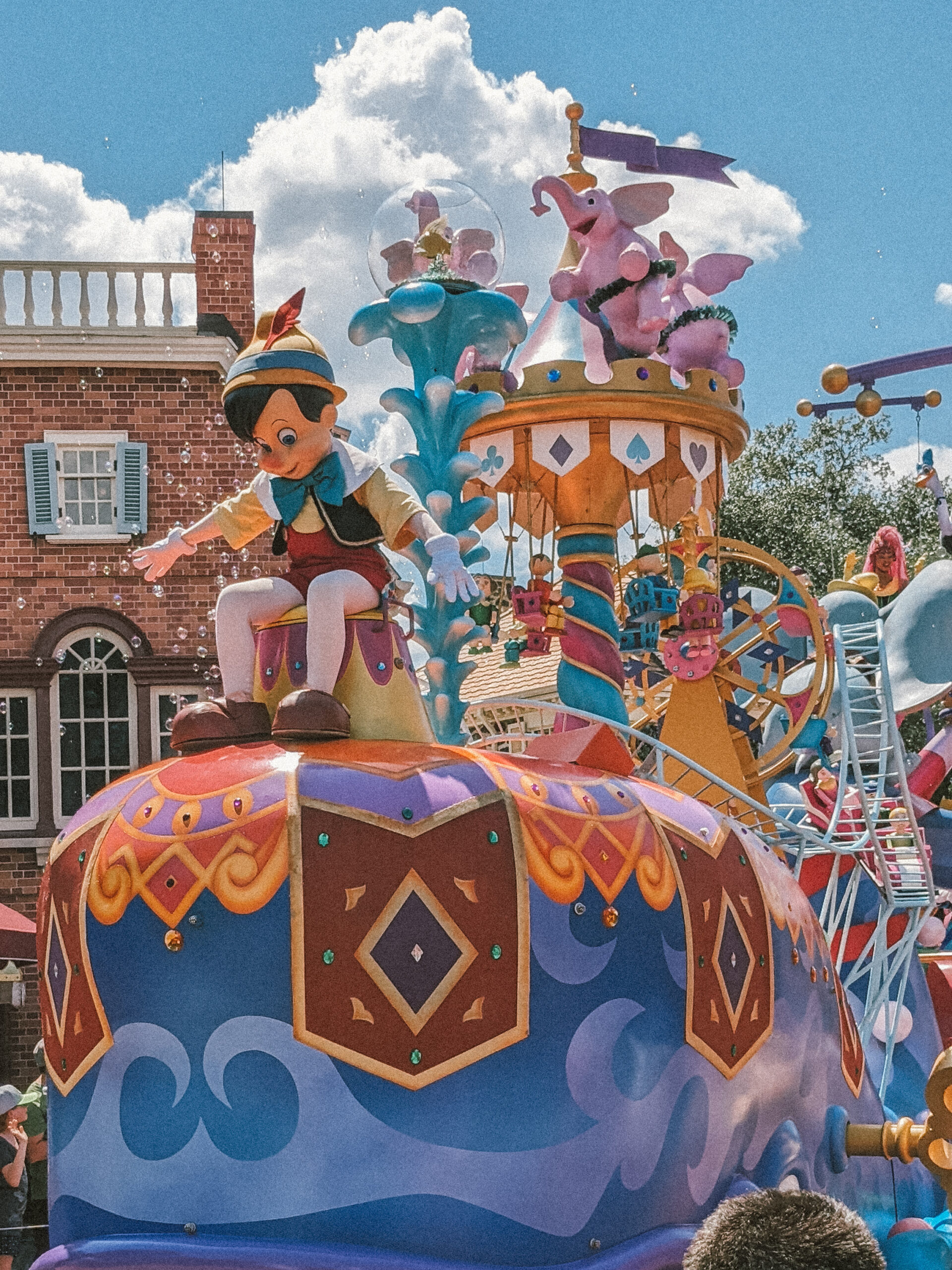 pinnochio on a parade float at disney world